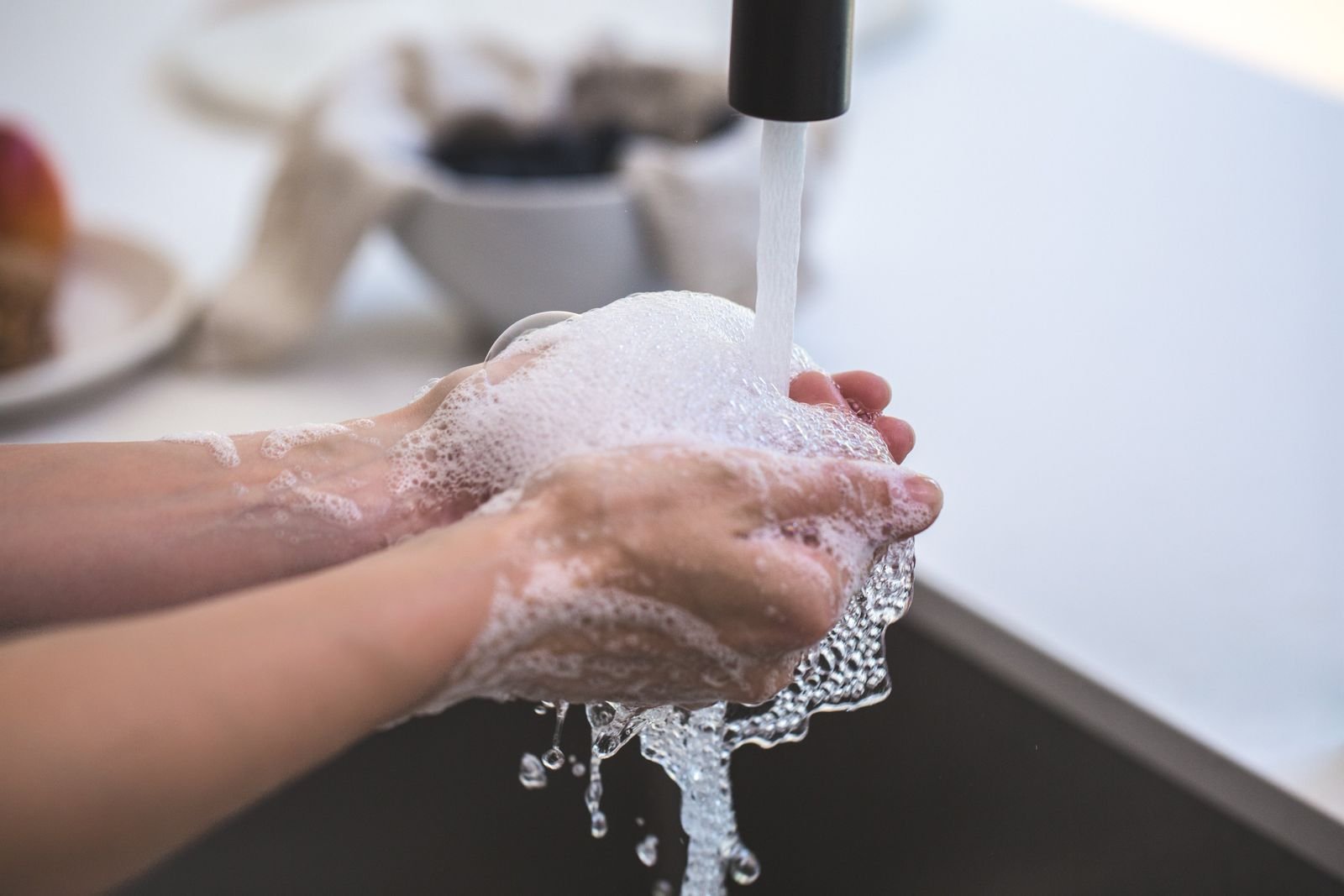 Unscented liquid soap and clean hands, the setup recommended for washing a new tattoo