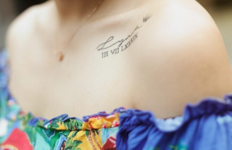Collarbone tattoo pain — close-up of a fine-line tattoo along the collarbone showing the thin-skin placement over bone