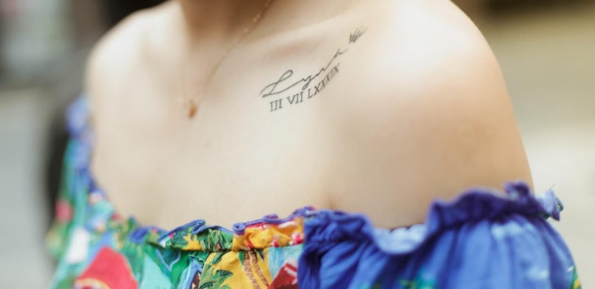 Collarbone tattoo pain — close-up of a fine-line tattoo along the collarbone showing the thin-skin placement over bone