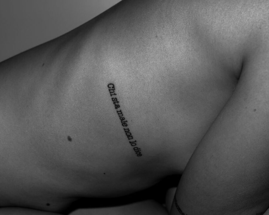 Rib tattoo pain during a side-torso session, the placement our pain chart rates very high