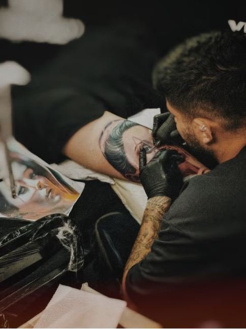 Tattoo styles guide comparing fine line, traditional, blackwork, and Japanese tattoo designs